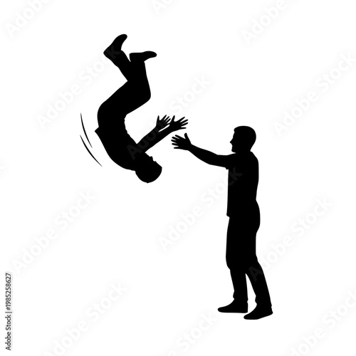 Silhouette of a man doing a backflip with another man assisting