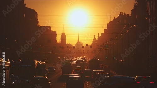 Saint-Petersburg, Russia - April 10 2026, 4k, panoramic view of Nevsky Prospect, cars on road, people walking on sidewalk, at sunset with bright sun, everything in orange light, St Petersburg, Russia