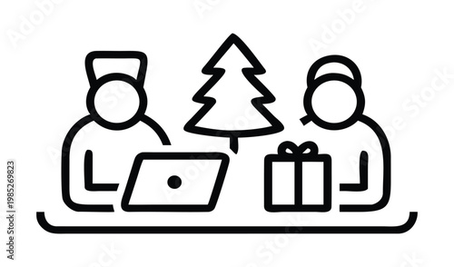 Two people at a desk with a laptop christmas tree and gift