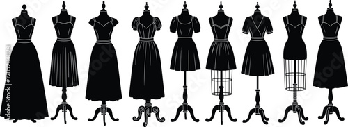 Collection of vintage black dresses on mannequins, fashion display for retro style clothing.