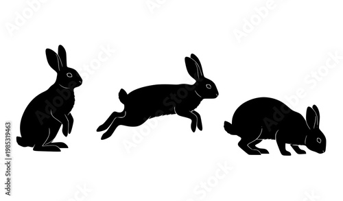 Set of rabbit silhouettes in sitting hopping and grazing poses isolated on white background