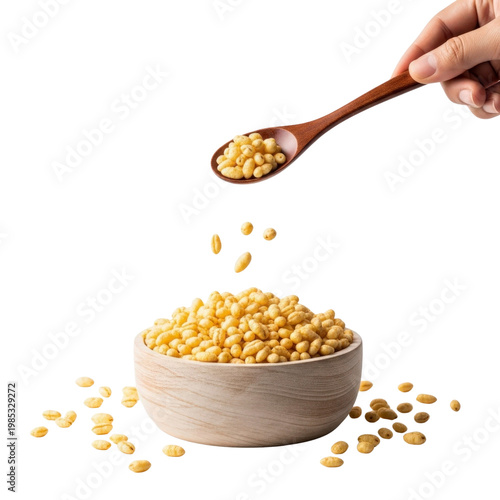 Cereal pouring from spoon into bowl