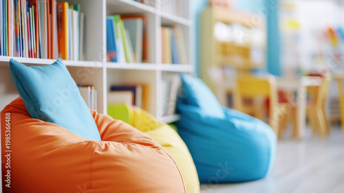 Cozy orange and blue bean bags near colorful bookshelves