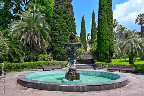 Fountain on a thuya alley in the Arboretum Park of Sochi, Krasnodar region of Russia