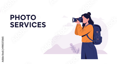 Professional female photographer with a backpack holding her camera and taking pictures outdoors against a mountain range.