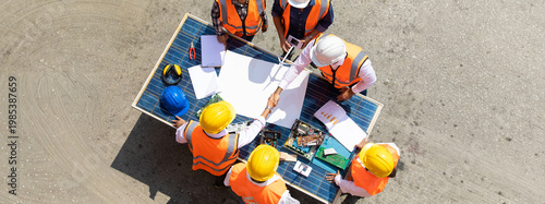 Ethnic diversity worker people, Success teamwork. Group of professional engineering people wearing hardhat safety helmet meeting with solar photovoltaic panels discussion in new project