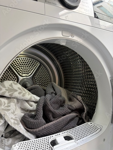 Bild auf Leinwand Fresh Laundry Inside Open Clothes Dryer Drum