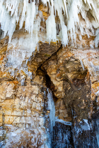Large icicles hang from the steep cliffs.