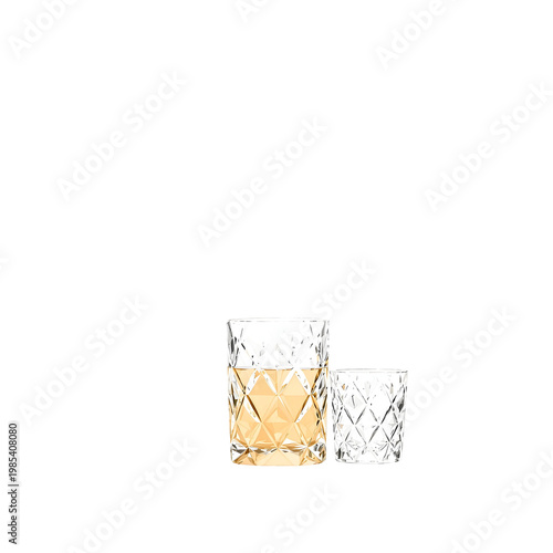 Two decorative glasses with golden liquid on transparent background