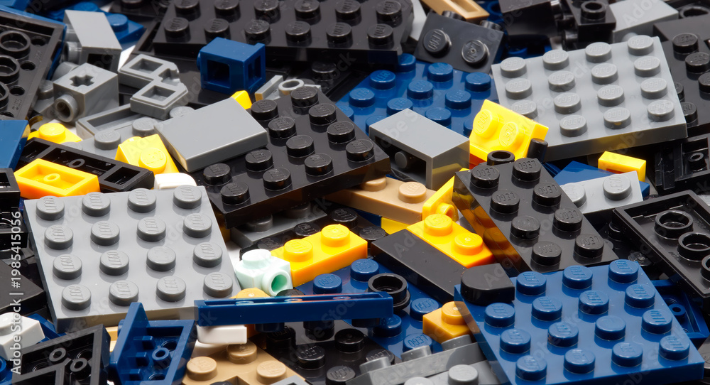 Fototapeta premium Bologna - Italy - April 14, 2026: Top view of interlocking plastic LEGO construction bricks isolated on white background.