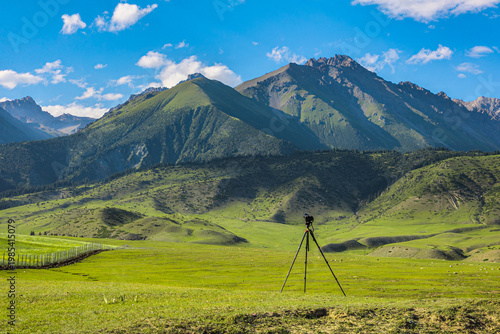 Camera on Tripod in Serene Mountainous Landscape