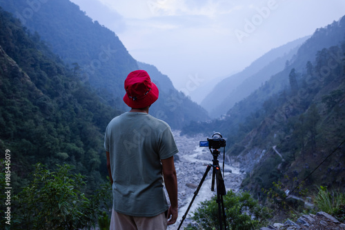 Photography A photographer capturing the breathtaking landscape of Madhyamaheshwar temple, U