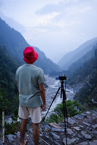 Photography A photographer capturing the serene beauty of Madhyamaheshwar temple, Uttarakhan