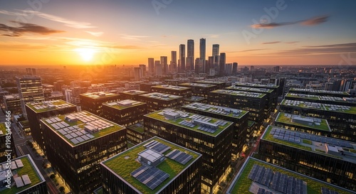 Modern cityscape during sunset with high-rise buildings and green rooftops.