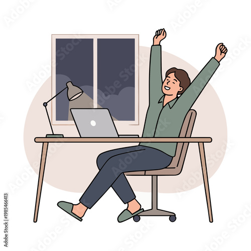 A man sits at a desk with laptop and lamp feeling happy