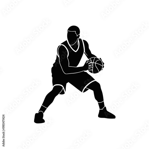 Basketball player stands in a ready stance while holding a ball firmly to prepare for a tactical offensive move during a standard training session or professional match on the court.
