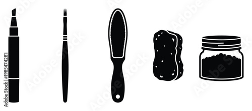 Collection of essential crafting tools including a marker, paintbrush, textured file, sponge, and a jar filled with granular material for creative projects and hobby supplies