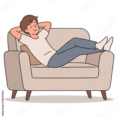 A man is relaxing on a beige sofa with his legs crossed