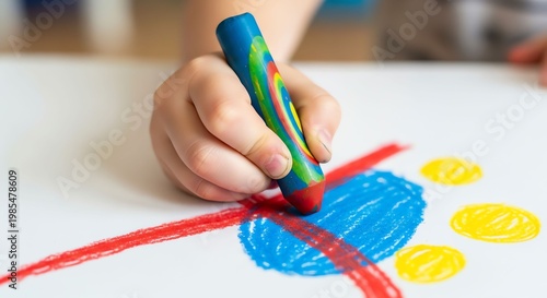 Child's Hand Drawing Colorful Shapes with Marker on White Paper.