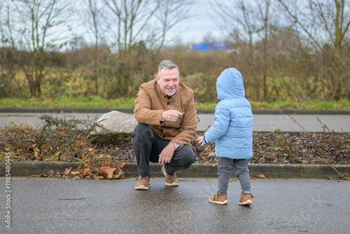 Grandfather Talking With Small Grandchild