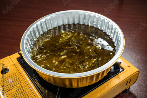 Seaweed hot pot soup base on gas stove