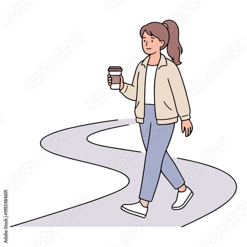 Woman walks on a path holding a coffee cup in her hand.