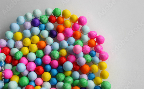 Heap of small colorful sugar coated candy balls as background

