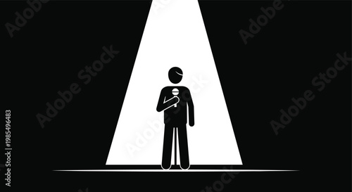 A solitary figure stands illuminated by a bright focused spotlight against a stark dark background creating a dramatic effect