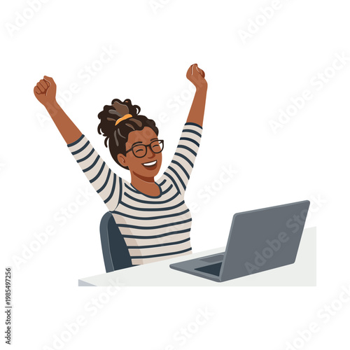 A woman celebrates with raised arms while sitting at a desk with a laptop.