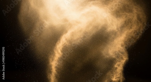 Dynamic golden dust or smoke swirling against a dark background, illuminated from above creating an ethereal effect.