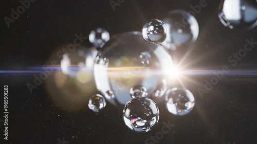 Elegant lens flare on black backdrop concept. Shiny transparent water bubbles floating with bright light and dark background in close up view