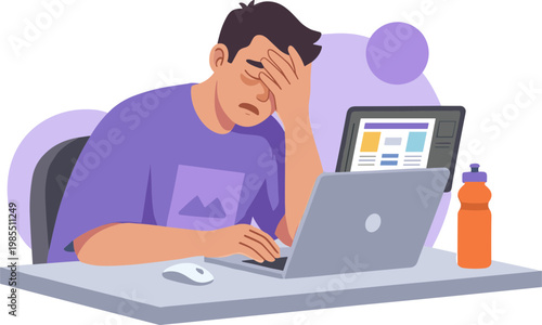 A stressed man sits at a desk with a laptop and tablet.