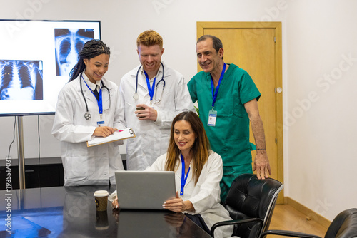 Medical team collaborating and sharing results in hospital meeting