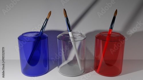 Vibrant paintbrushes in colorful glass jars on modern desk