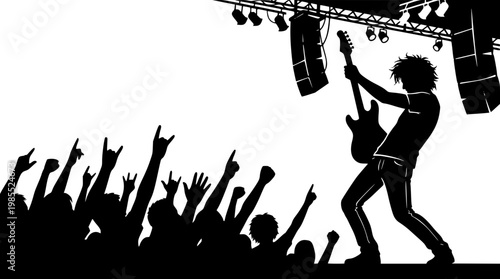 Silhouette of rock musician performing on stage with fans