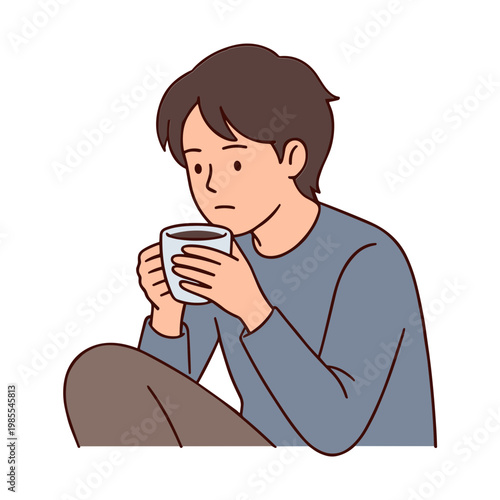 A man sits sipping coffee looking sad and lonely indoors