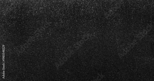 фотографія A black texture featuring a dense cluster of small, irregularly shaped oval bump