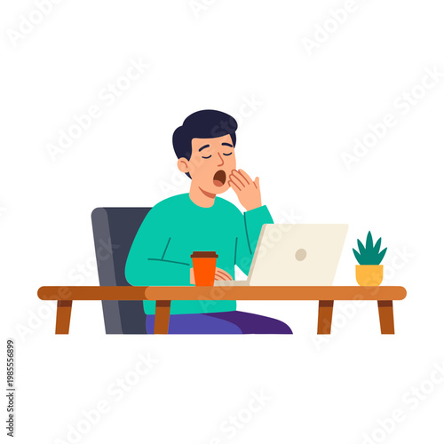 Man yawns while sitting at desk with laptop and coffee