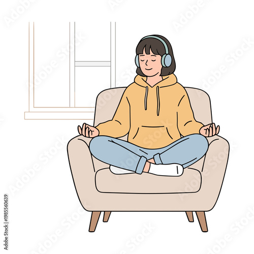 Woman meditates peacefully indoors wearing headphones on chair by window