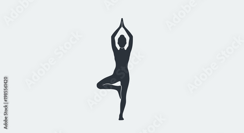 Silhouette of woman in tree pose yoga asana against plain backdrop in studio for wellness concept and calm meditative exercise