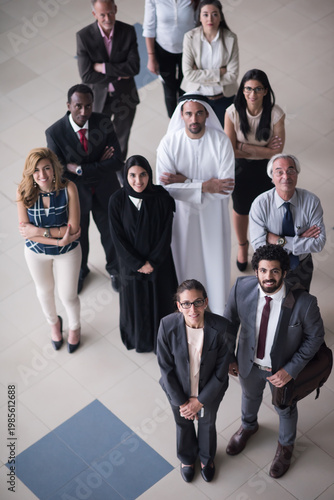 Diverse business team of multicultural professionals standing together in modern office lobby