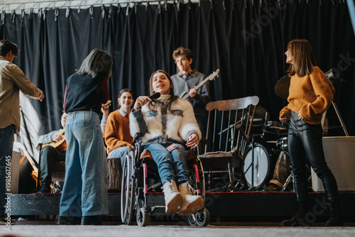 Student in a wheelchair sings into a microphone while classmates play instruments on stage. A group of students rehearses together in an inclusive band setting.