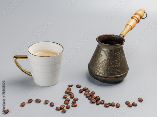 Cup of coffee, a cezve with roasted coffee beans.
