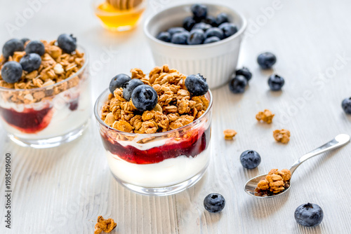 Healthy morning with granola breakfast on white kitchen table