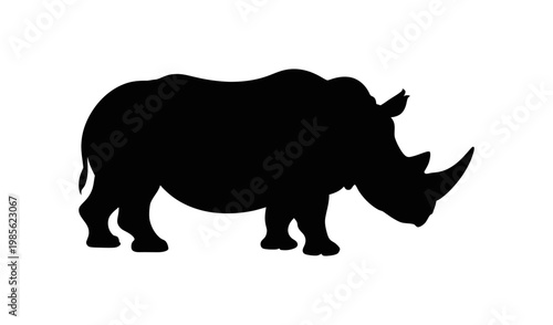 Vector silhouette of a rhinoceros walking on a plain surface with a bold black design