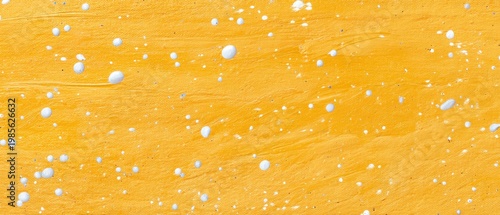 Golden Yellow Textured Background With White Splashes And Speckles Close Up Detail
