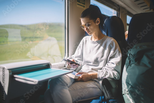 Travel woman using smart phone on train transport