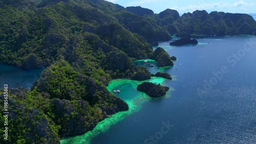 Coron Lagoon with limestone karsts turquoise waters. Unique aerial view drone
