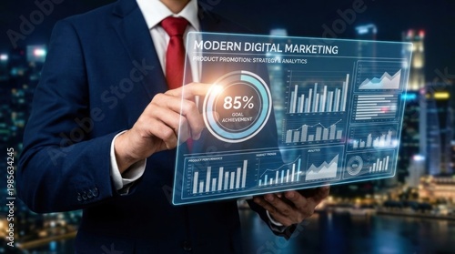 A businessman in a suit holds a digital marketing screen at night