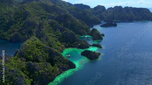 Coron Lagoon with limestone karsts turquoise waters. Lovely aerial view drone